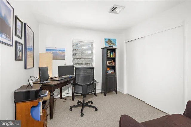 a view of a workspace with furniture