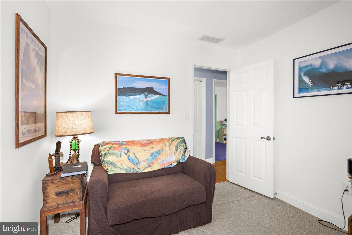 128 Edmore Road Chestertown, MD 21620 - Photo 23 of 59 a living room with furniture and a lamp