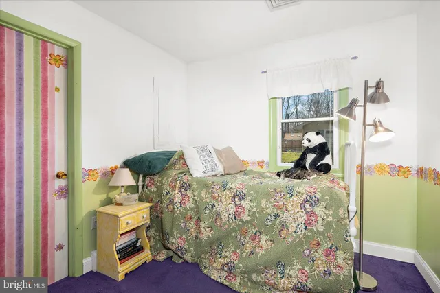 a view of a dresser and chair in a room
