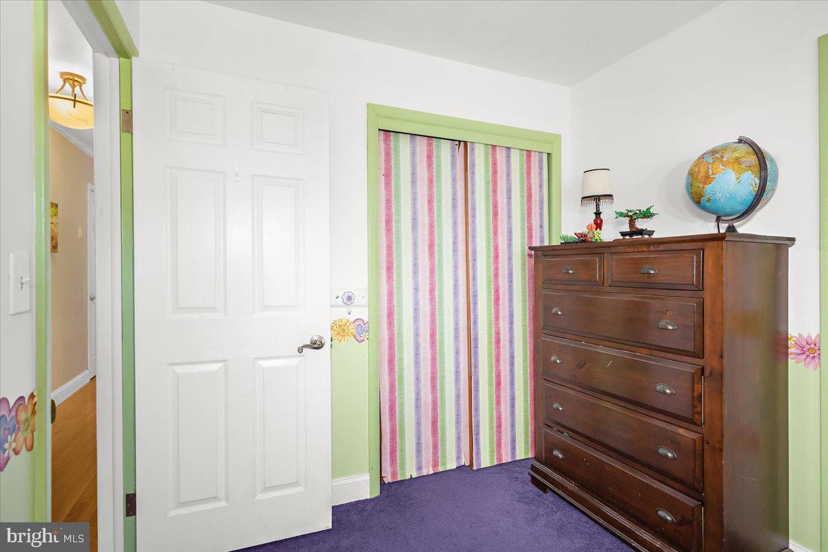 128 Edmore Road Chestertown, MD 21620 - Photo 27 of 59 a view of a dresser and chair in a room