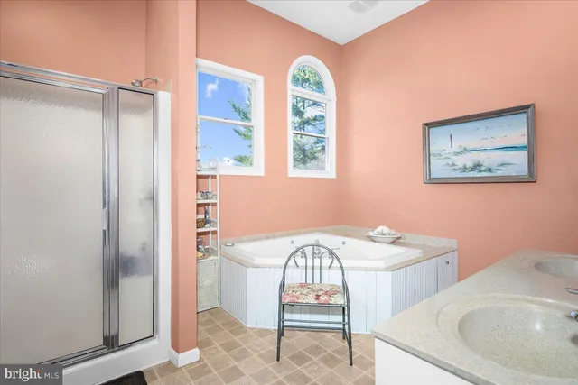 a front view of a house with swimming pool and sitting area