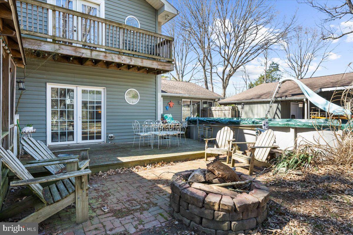 128 Edmore Road Chestertown, MD 21620 - Photo 35 of 59 a front view of a house with swimming pool and sitting area