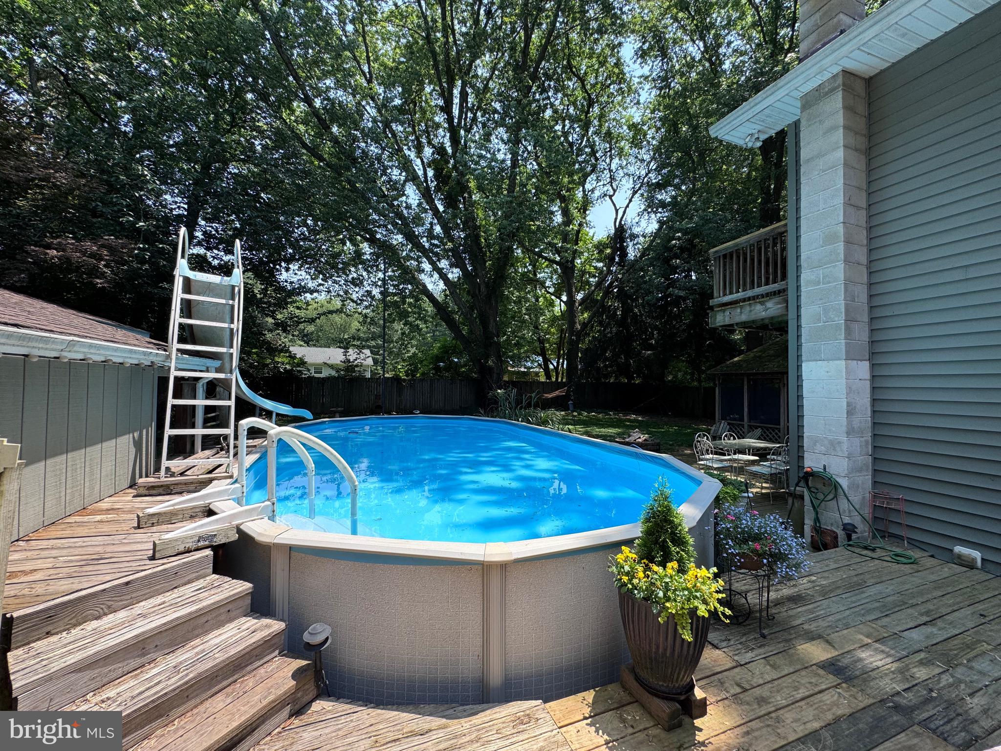 128 Edmore Road Chestertown, MD 21620 - Photo 37 of 59 a view of a patio with chairs and potted plants