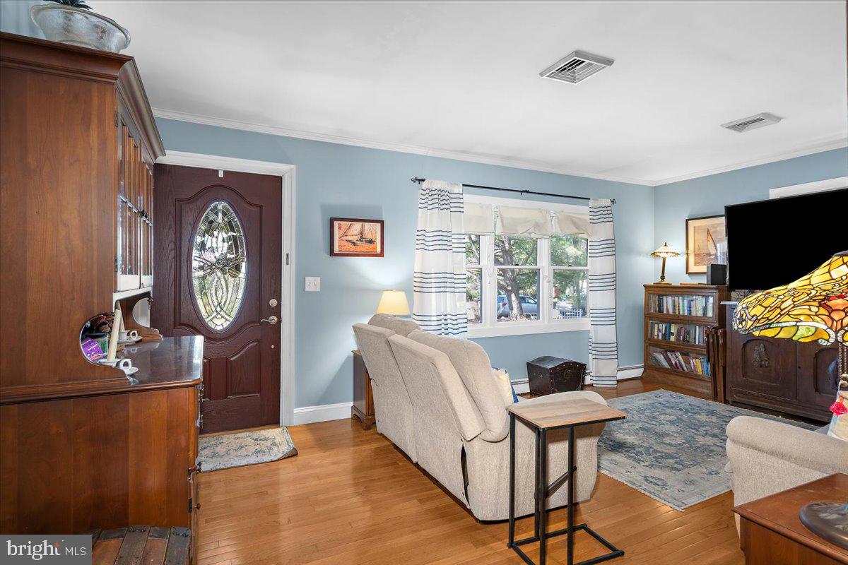 128 Edmore Road Chestertown, MD 21620 - Photo 8 of 59 a living room with furniture a window and a flat screen tv