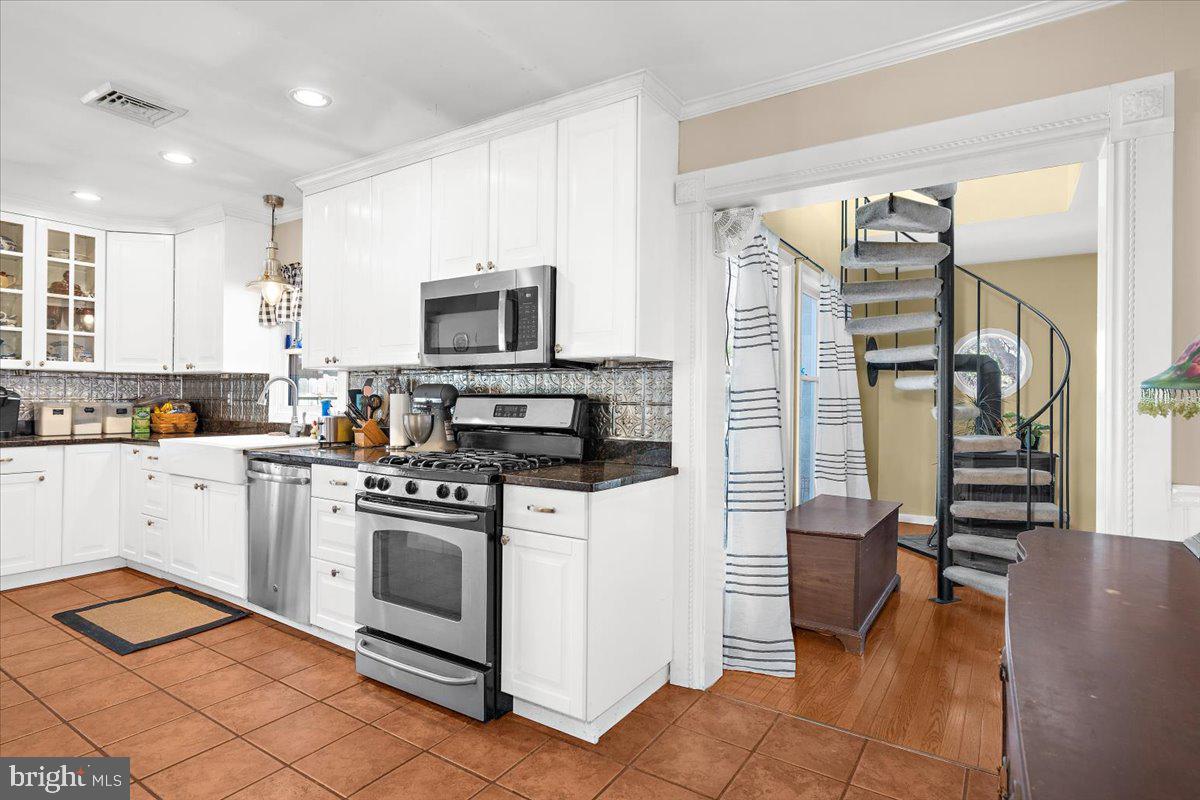 128 Edmore Road Chestertown, MD 21620 - Photo 9 of 59 a kitchen with stainless steel appliances granite countertop a refrigerator and a stove top oven