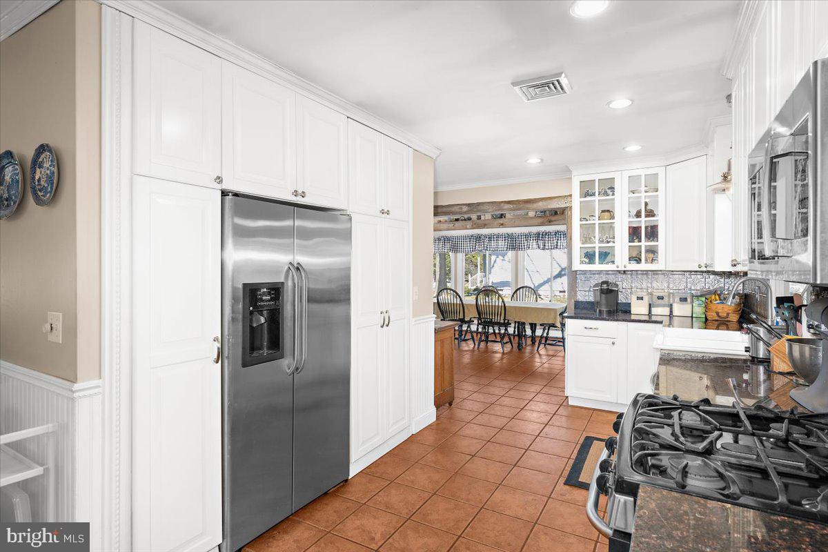 128 Edmore Road Chestertown, MD 21620 - Photo 10 of 59 a kitchen with stainless steel appliances granite countertop a refrigerator and a stove top oven