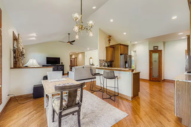 a view of a dining room with furniture and wooden floor