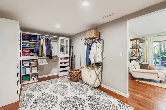 a view of a livingroom with furniture and a bedroom