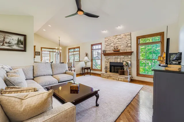 a living room with furniture and a fireplace