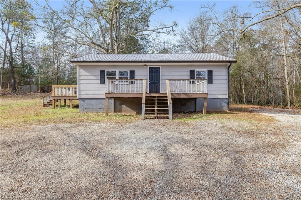 75 Lake Street Jefferson, GA 30549 - Photo 1 of 35 front view of a house with a yard and a large tree
