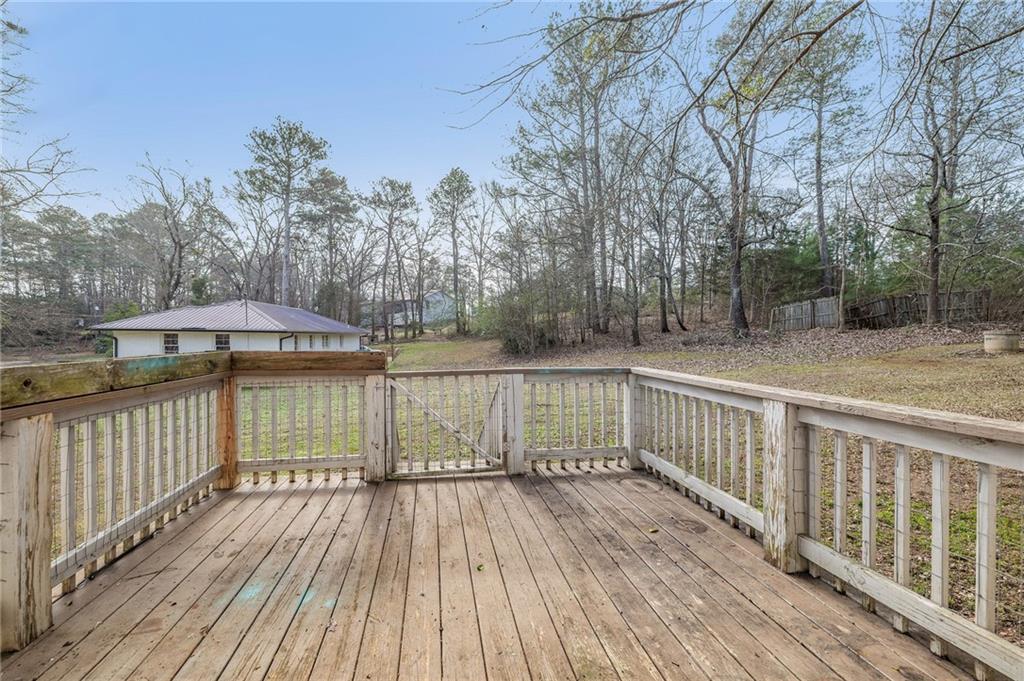 75 Lake Street Jefferson, GA 30549 - Photo 16 of 35 a view of balcony with wooden floor and fence