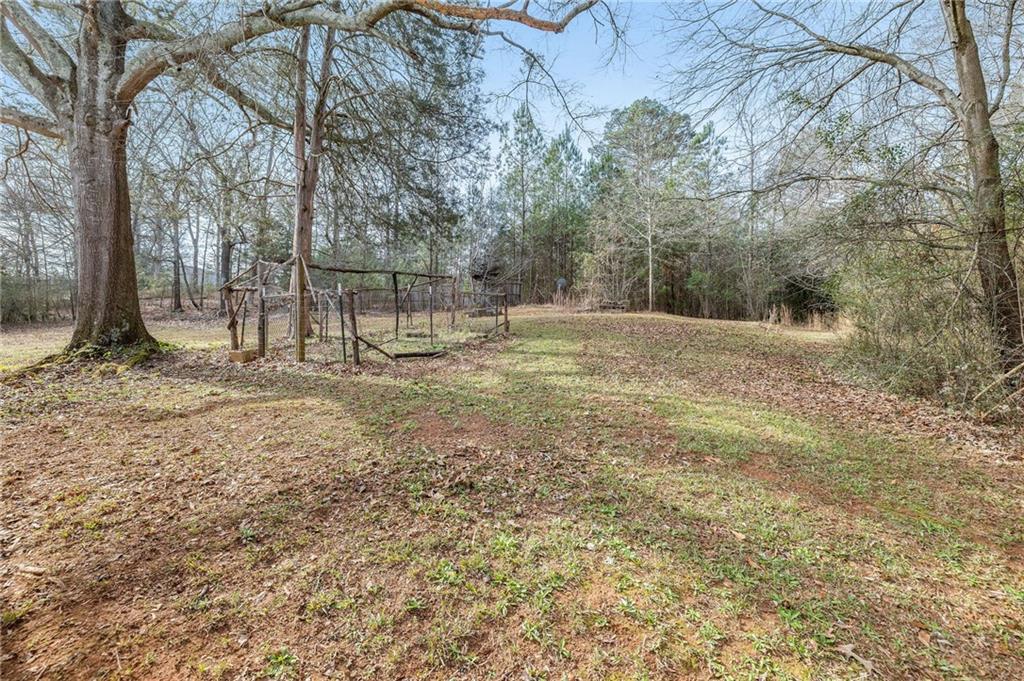 75 Lake Street Jefferson, GA 30549 - Photo 17 of 35 a backyard of a house with lots of green space