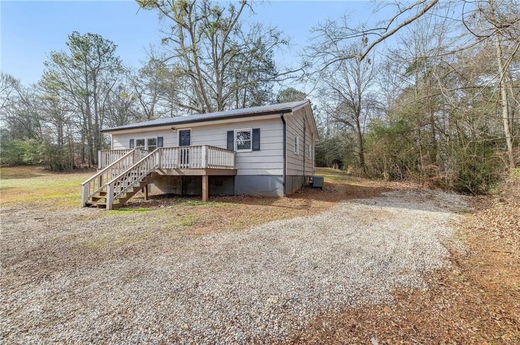 75 Lake Street Jefferson, GA 30549 - Photo 2 of 35 a view of a house with backyard