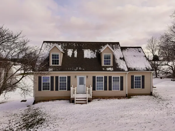 a house with trees in front of it
