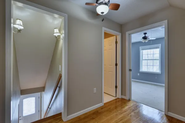 an empty room with windows and closet