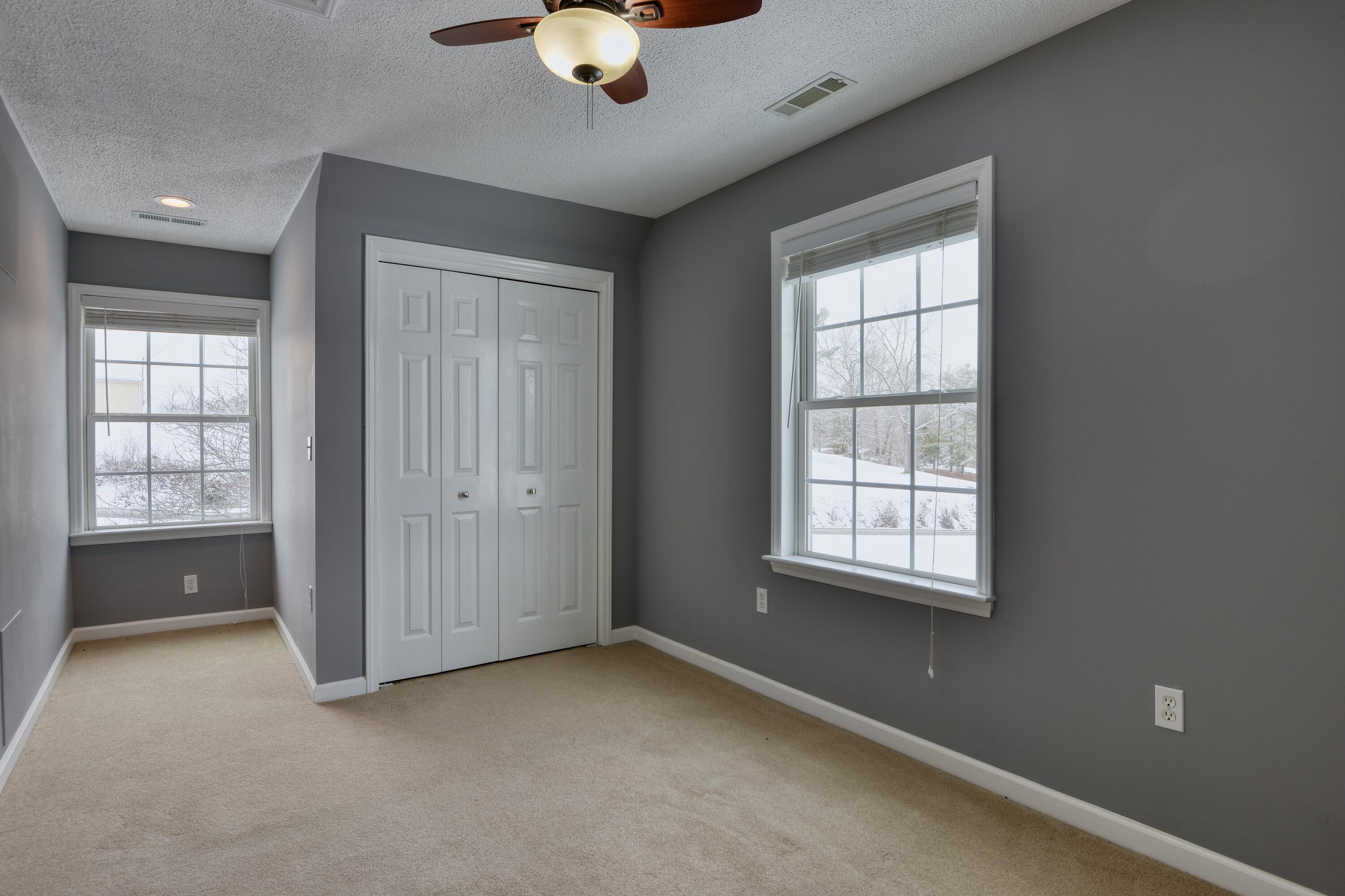 4530 Piney Woods Road Riner, VA 24149 - Photo 28 of 60 an empty room with windows and closet