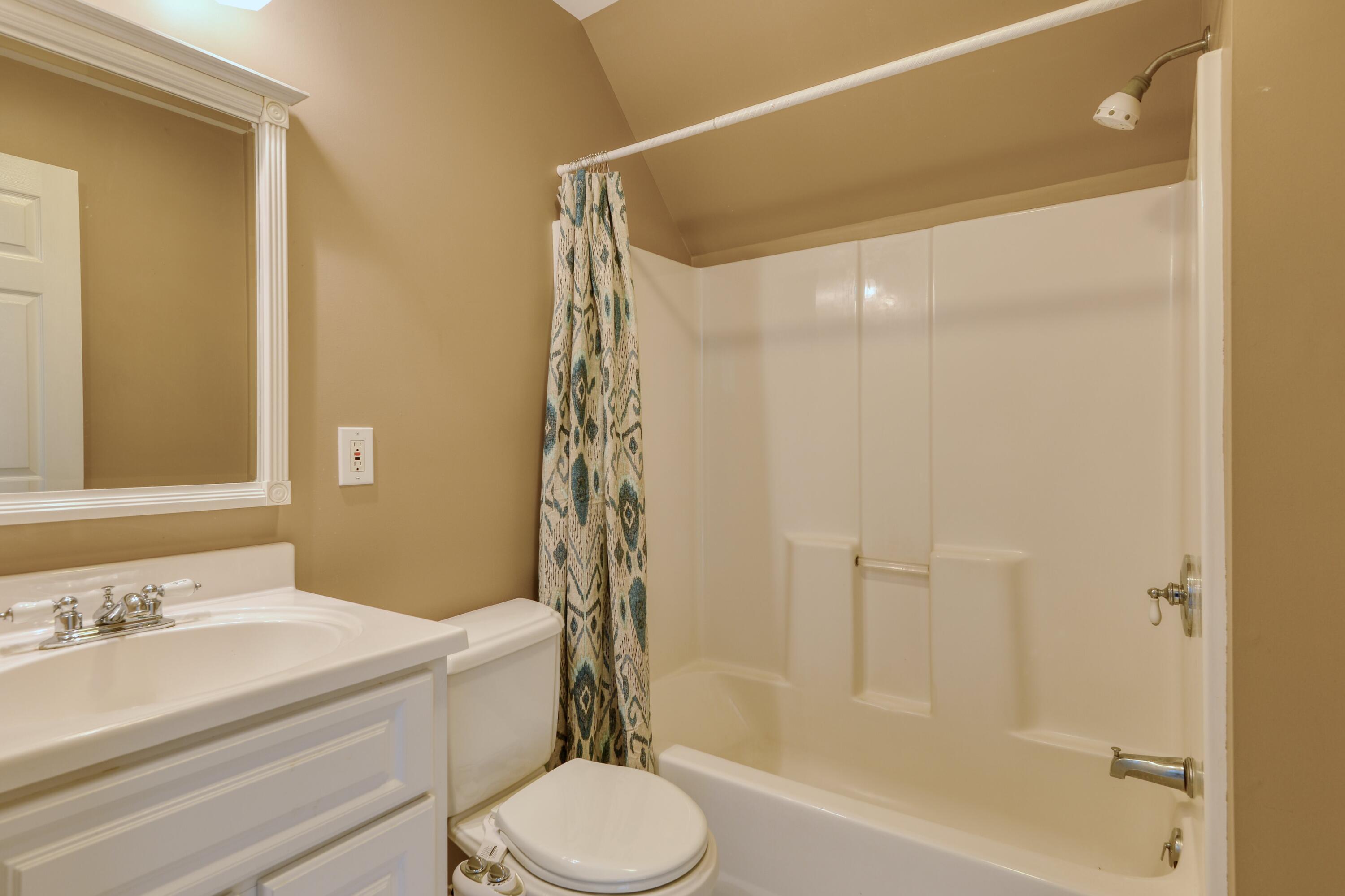 4530 Piney Woods Road Riner, VA 24149 - Photo 33 of 60 a bathroom with a sink toilet and shower