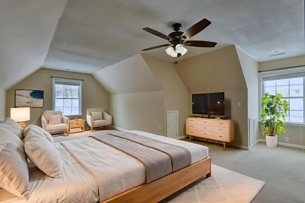 a view of a house with a yard and sitting area