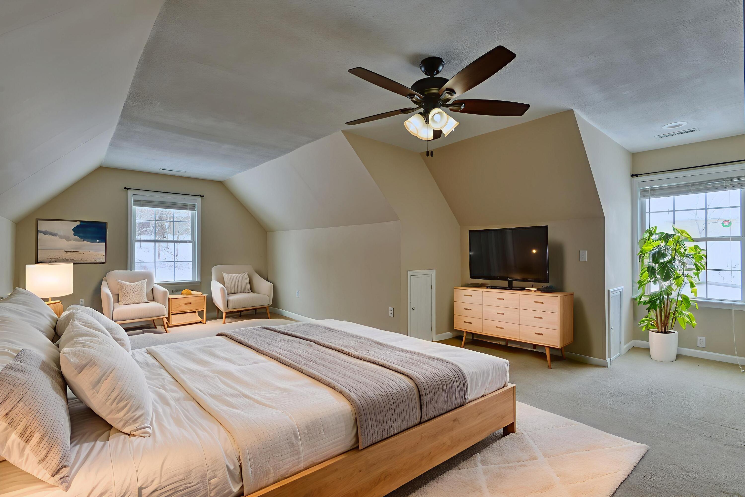 4530 Piney Woods Road Riner, VA 24149 - Photo 35 of 60 a bedroom with a bed a ceiling fan and a dresser