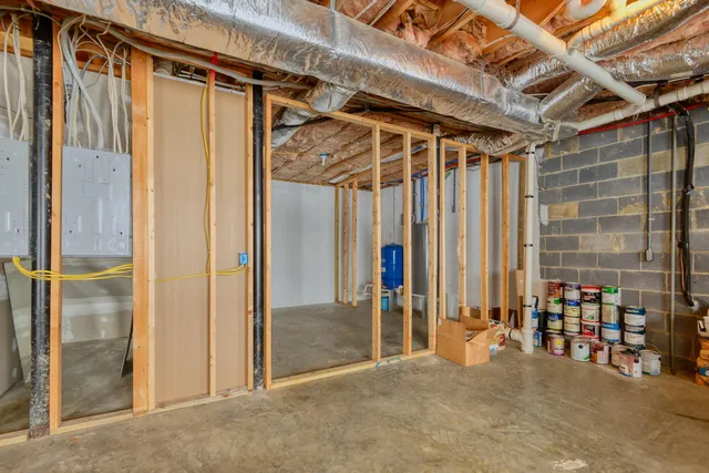 a view of a backyard with wooden fence