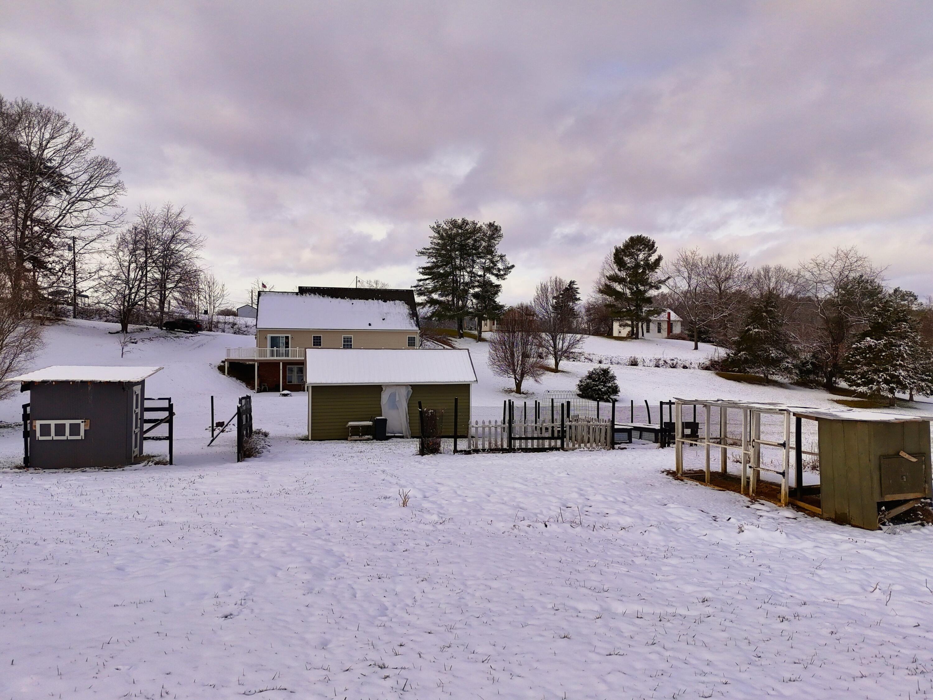 4530 Piney Woods Road Riner, VA 24149 - Photo 42 of 60 a view of a house with a yard and sitting area