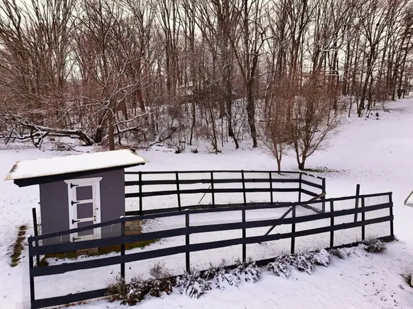 a balcony with table and chairs