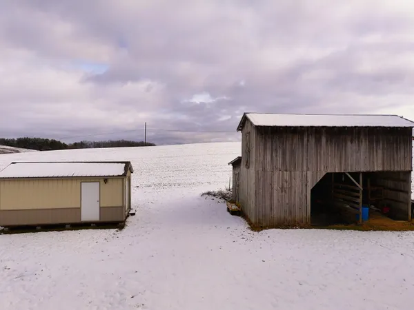 a view of a house with a yard and garage