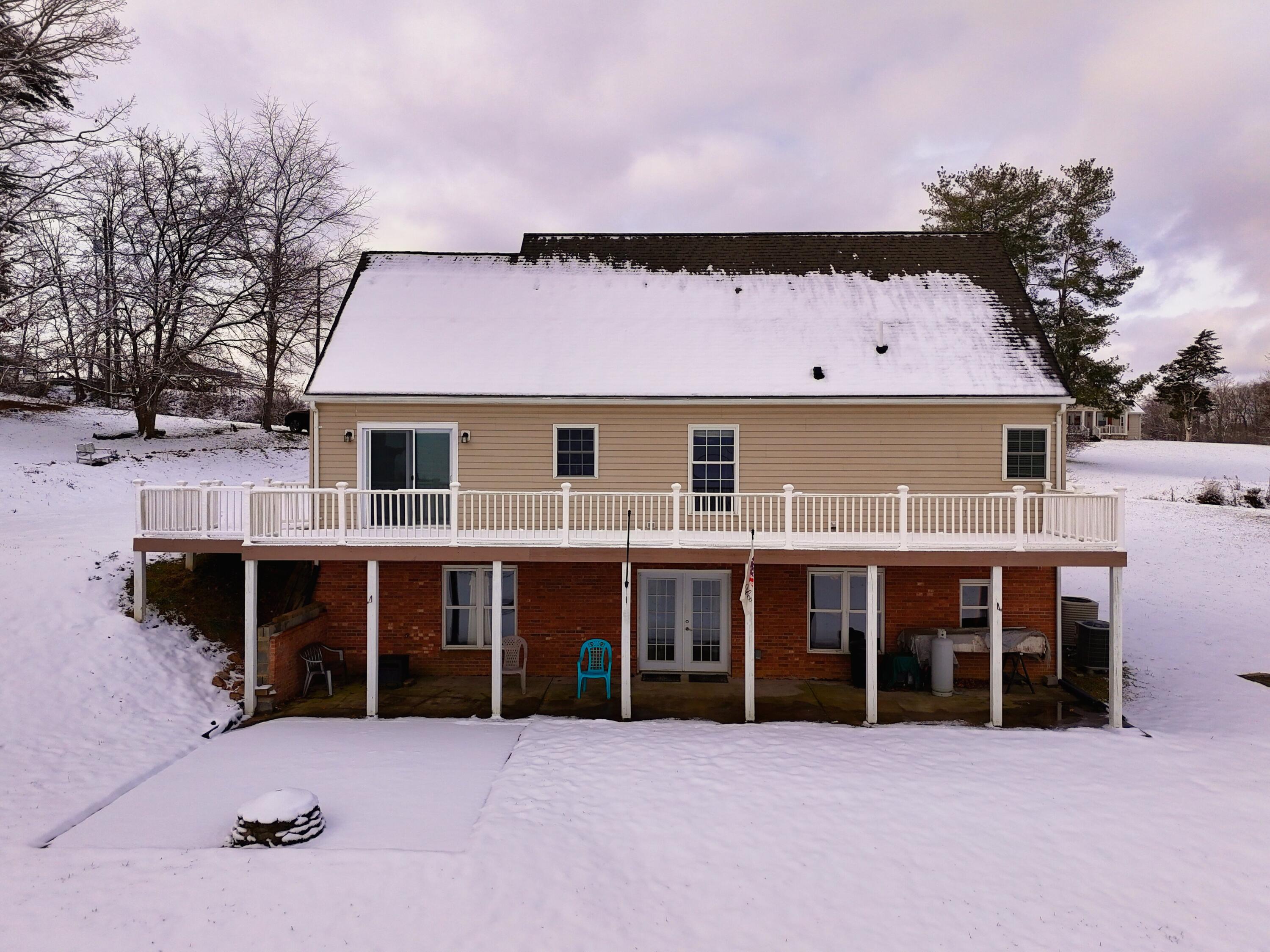 4530 Piney Woods Road Riner, VA 24149 - Photo 57 of 60 a view of a house with a yard and garage