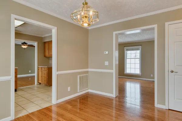 a kitchen with granite countertop cabinets stainless steel appliances a sink and a window
