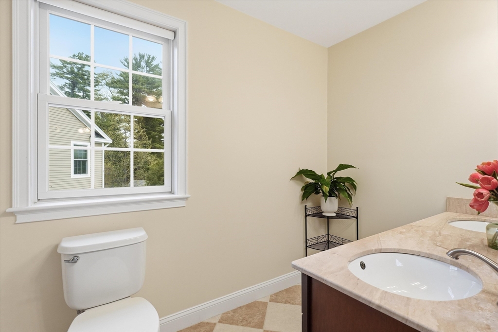 2 B Gates Lane, Unit B Wakefield, MA 01880 - Photo 17 of 42 a bathroom with a sink and a toilet