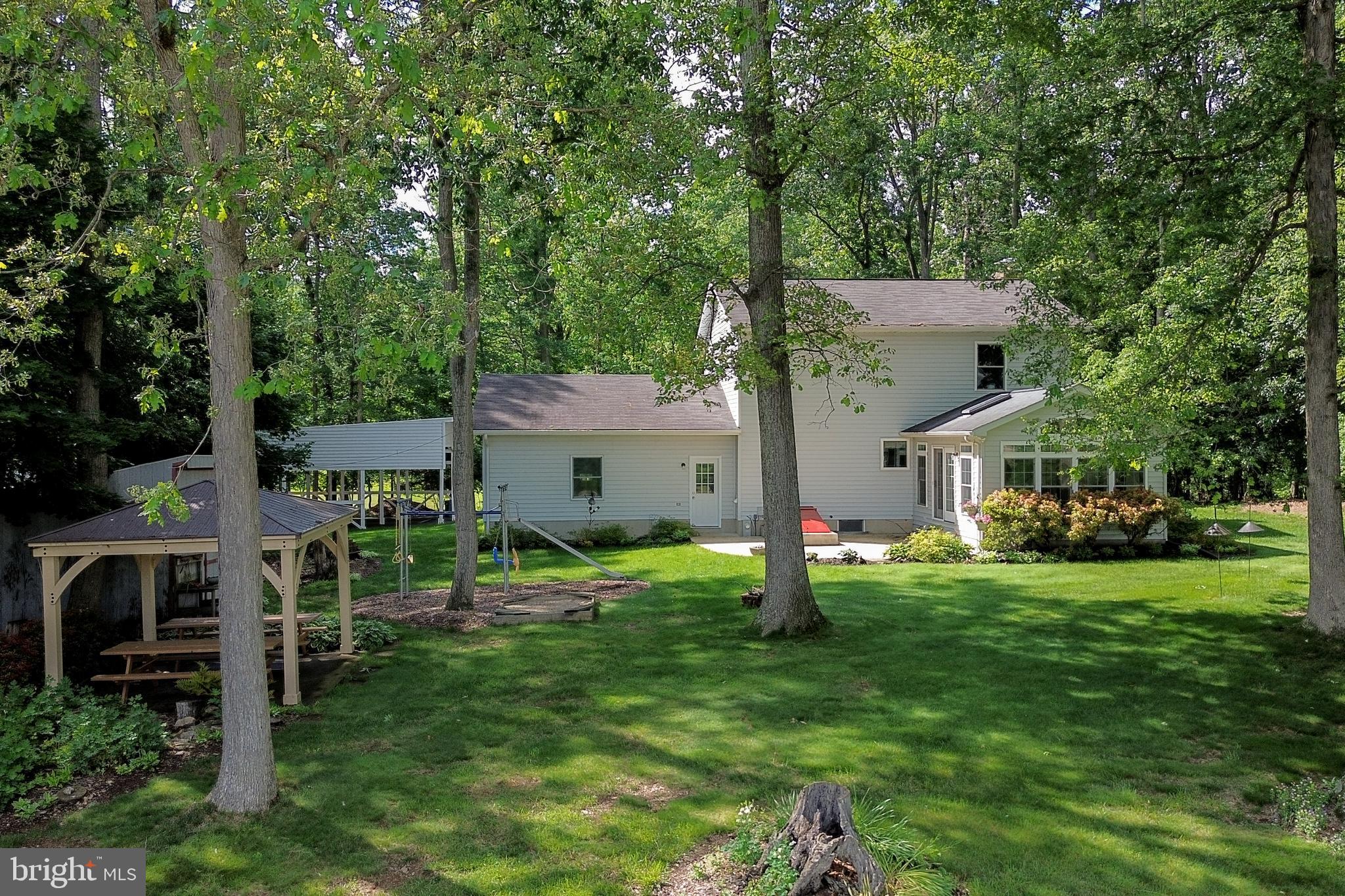 5313 Wentz Road Manchester, MD 21102 - Photo 46 of 51 a view of a house with backyard and a tree