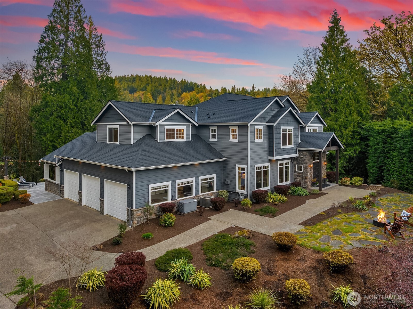 16908 Southeast Licorice Way Newcastle, WA 98059 - Photo 1 of 1 a front view of a house with a garden