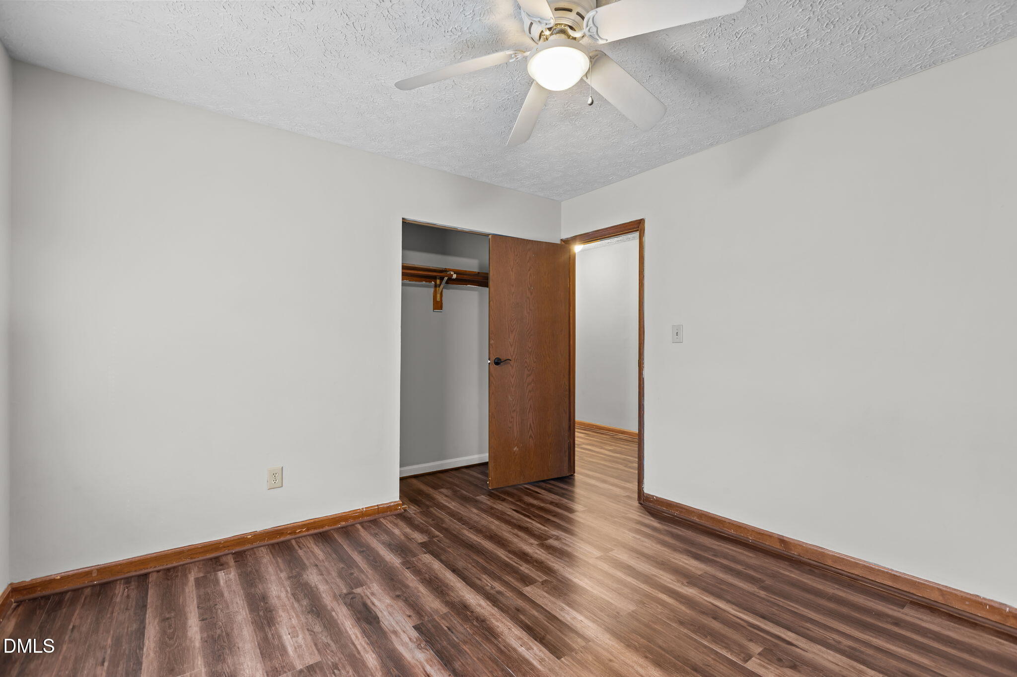 2501 Anne Carol Court Raleigh, NC 27603 - Photo 19 of 36 a view of an empty room with wooden floor