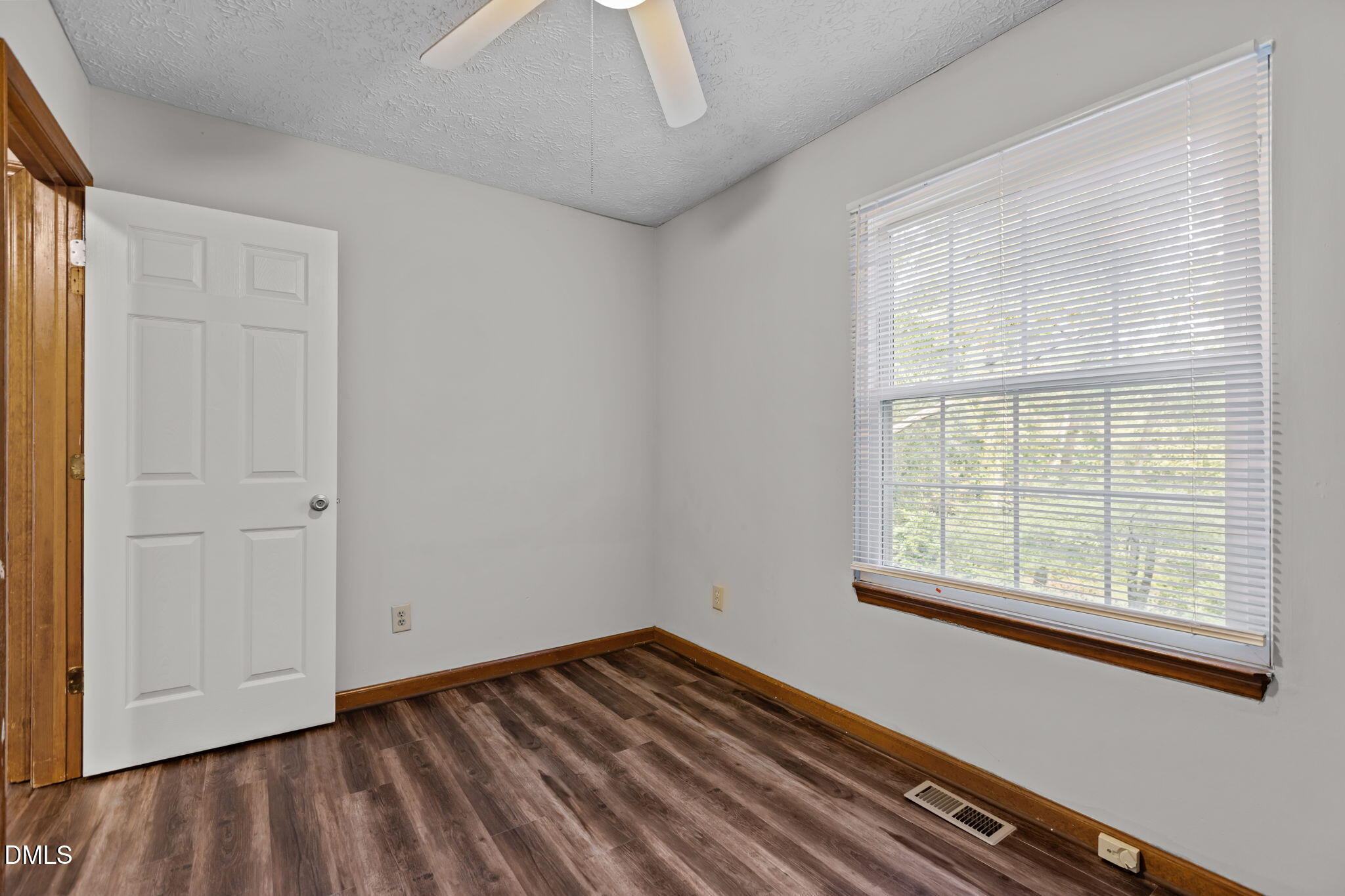 2501 Anne Carol Court Raleigh, NC 27603 - Photo 24 of 36 a view of a room with wooden floor and windows