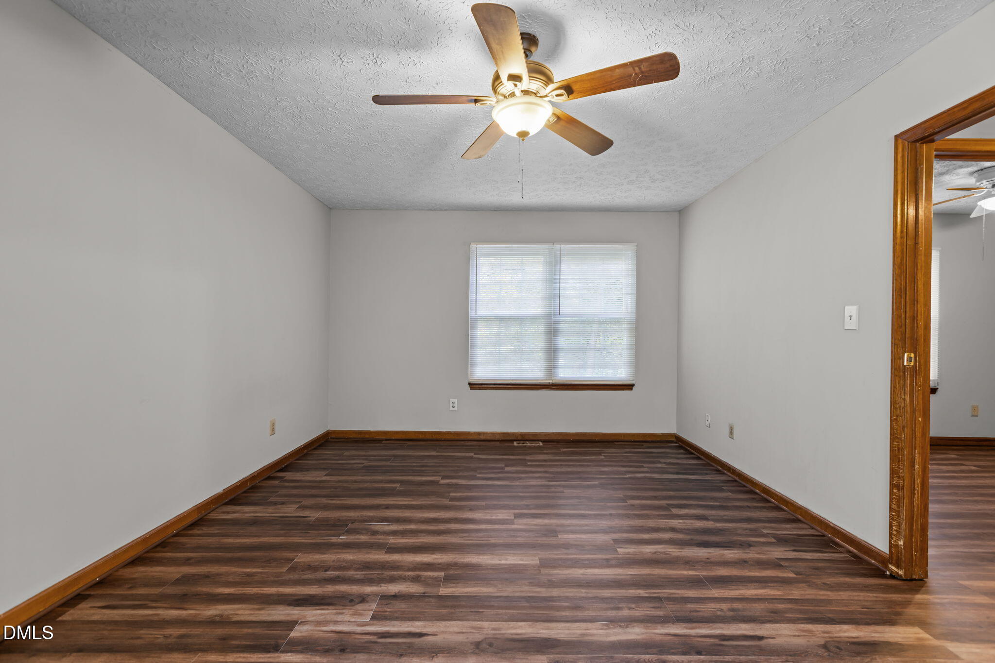 2501 Anne Carol Court Raleigh, NC 27603 - Photo 26 of 36 wooden floor in an empty room with a window