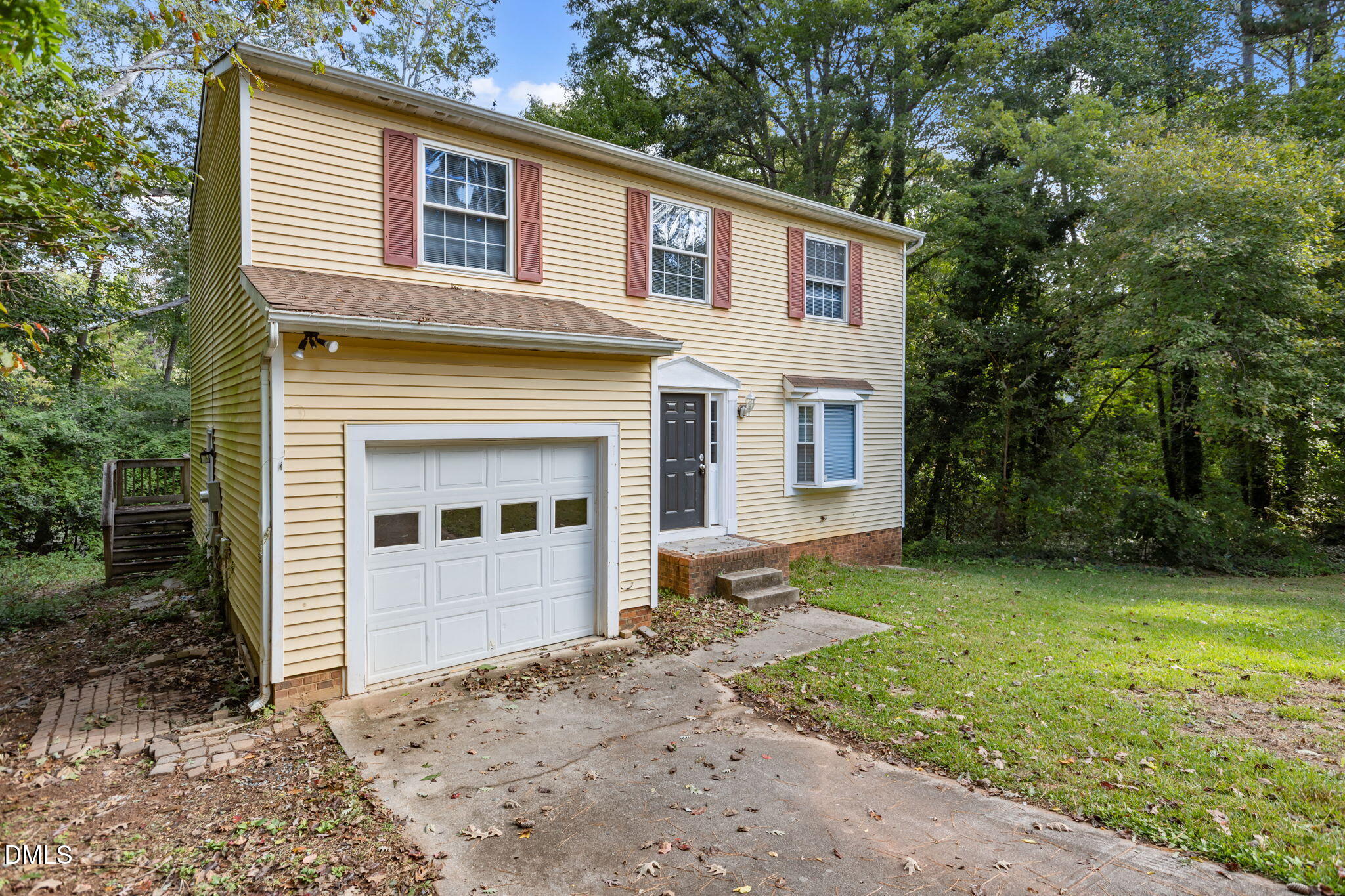 2501 Anne Carol Court Raleigh, NC 27603 - Photo 33 of 36 a front view of a house with a yard and garage