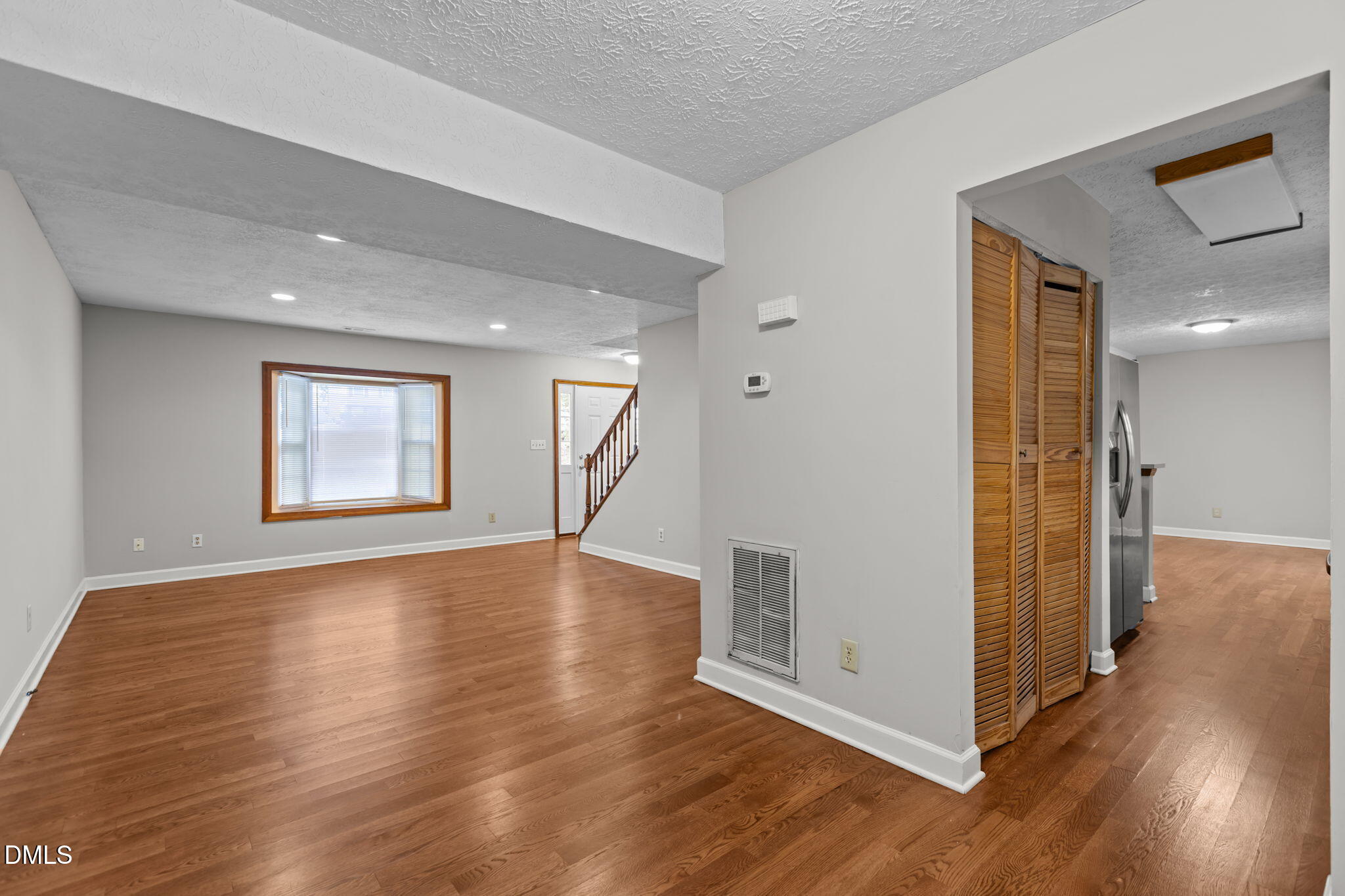 2501 Anne Carol Court Raleigh, NC 27603 - Photo 8 of 36 a view of empty room with wooden floor and fan