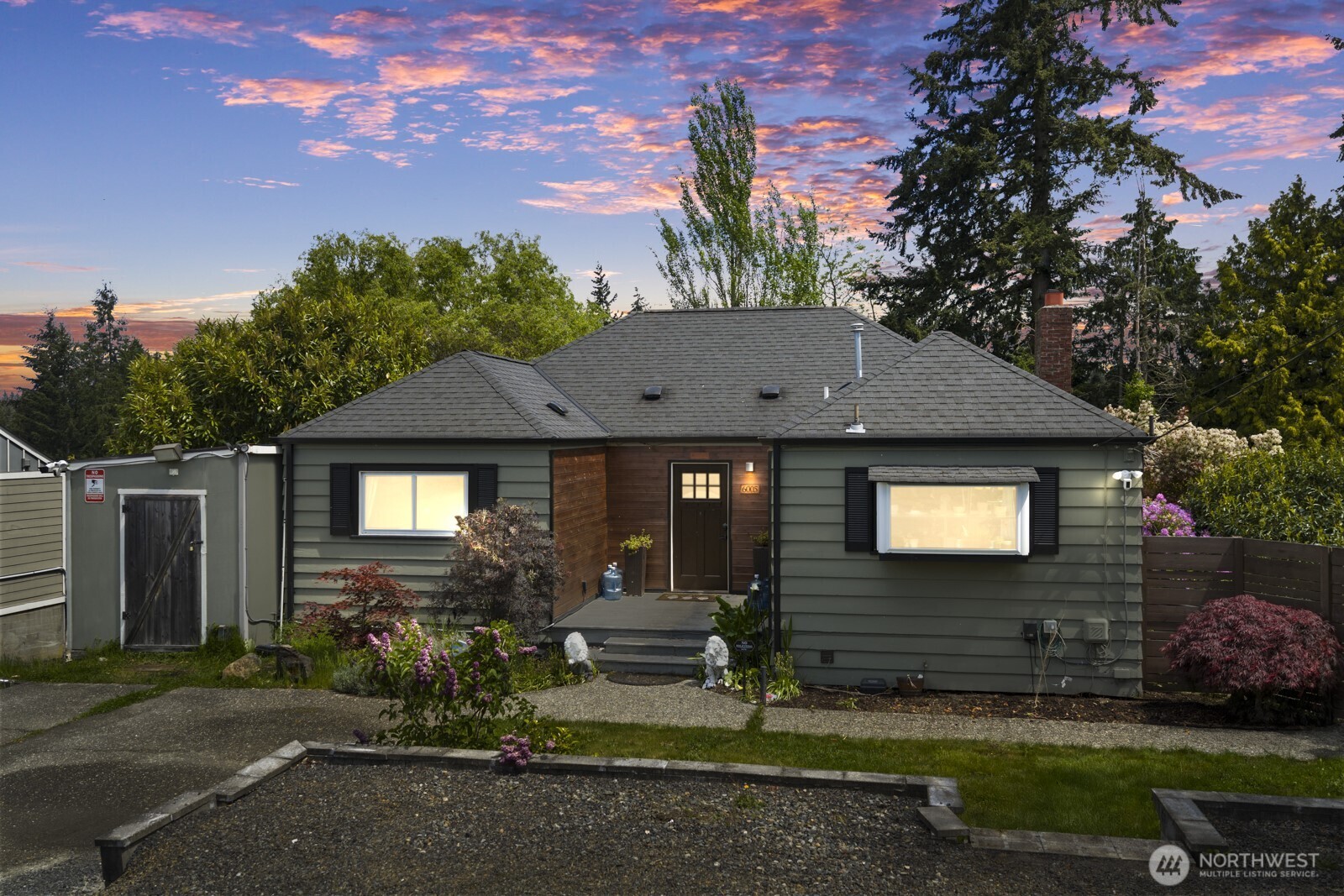 a front view of a house with garden