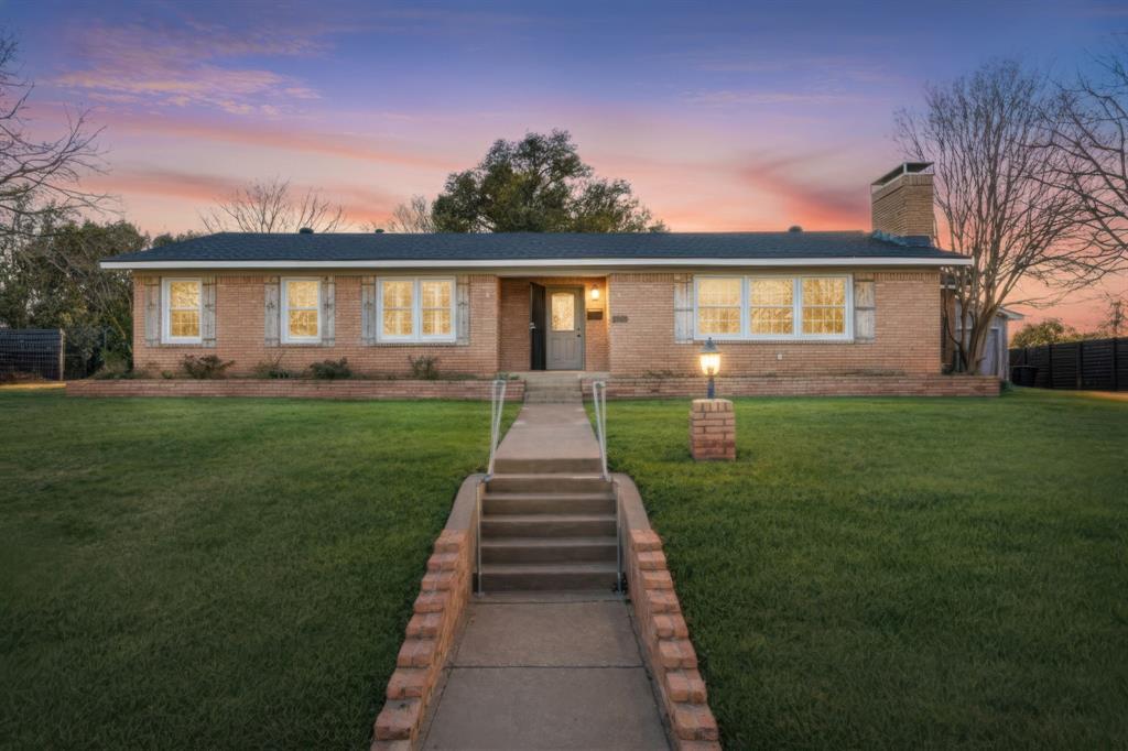 2208 Lake Ridge Circle Waco, TX 76710 - Photo 1 of 40 Single story home with a front yard, a chimney, and brick siding