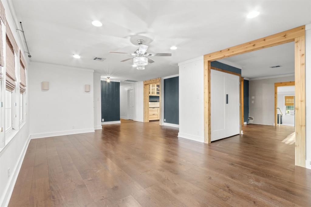 2208 Lake Ridge Circle Waco, TX 76710 - Photo 12 of 40 Unfurnished room featuring crown molding, dark wood finished floors, a ceiling fan, and recessed lighting