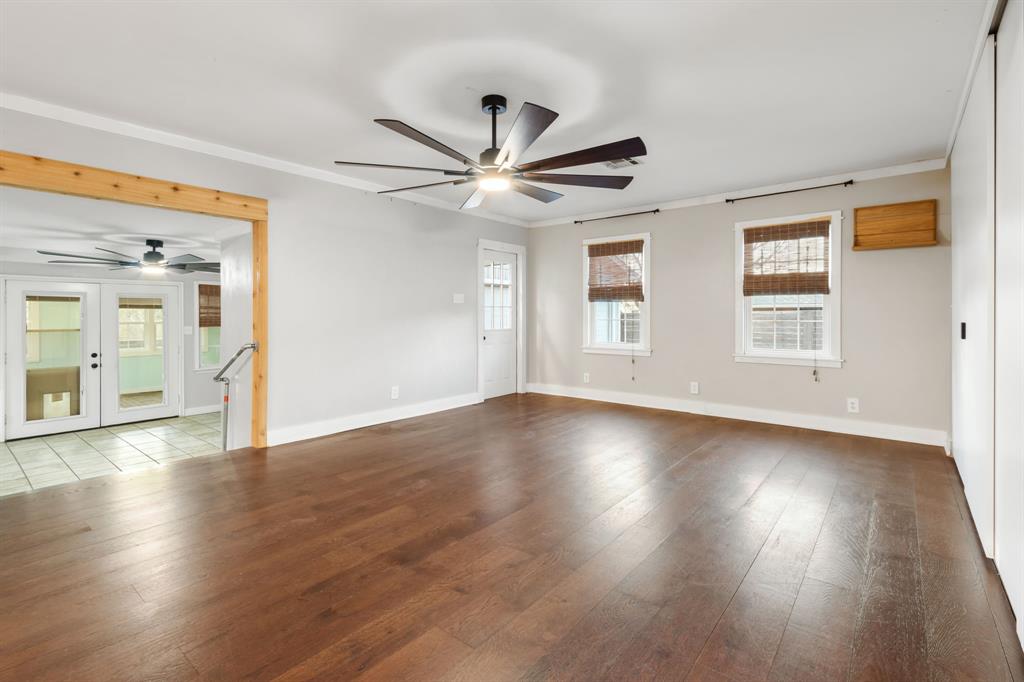 2208 Lake Ridge Circle Waco, TX 76710 - Photo 22 of 40 Unfurnished room featuring a ceiling fan, french doors, hardwood / wood-style floors, plenty of natural light, and ornamental molding