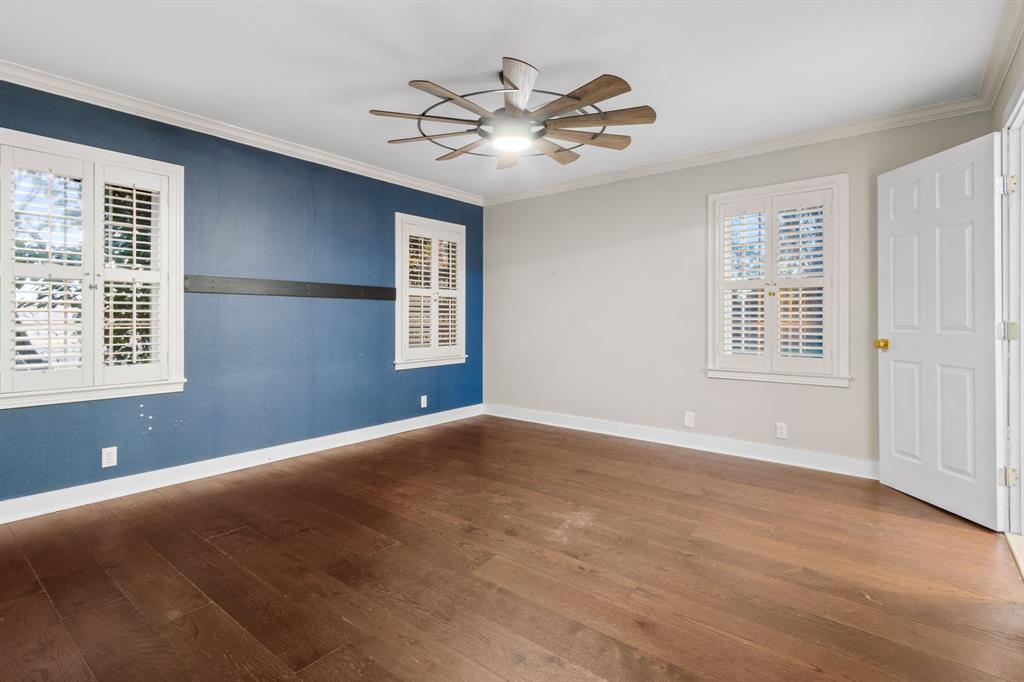 2208 Lake Ridge Circle Waco, TX 76710 - Photo 30 of 40 Spare room featuring ceiling fan, ornamental molding, and dark wood finished floors