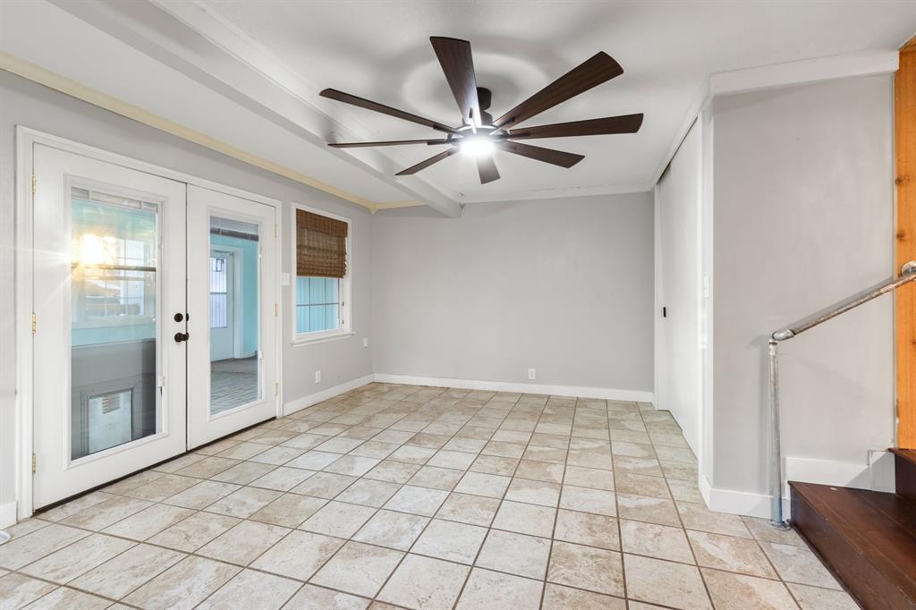2208 Lake Ridge Circle Waco, TX 76710 - Photo 33 of 40 Empty room featuring ceiling fan, french doors, and crown molding