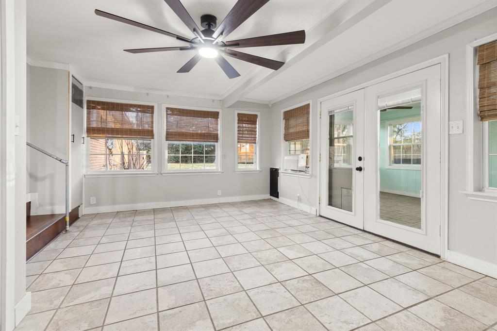 2208 Lake Ridge Circle Waco, TX 76710 - Photo 34 of 40 Unfurnished sunroom with french doors, crown molding, and tile patterned flooring