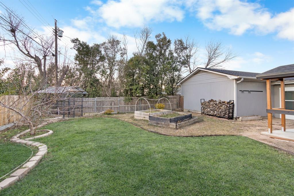 2208 Lake Ridge Circle Waco, TX 76710 - Photo 39 of 40 Fenced backyard featuring a vegetable garden and a patio area