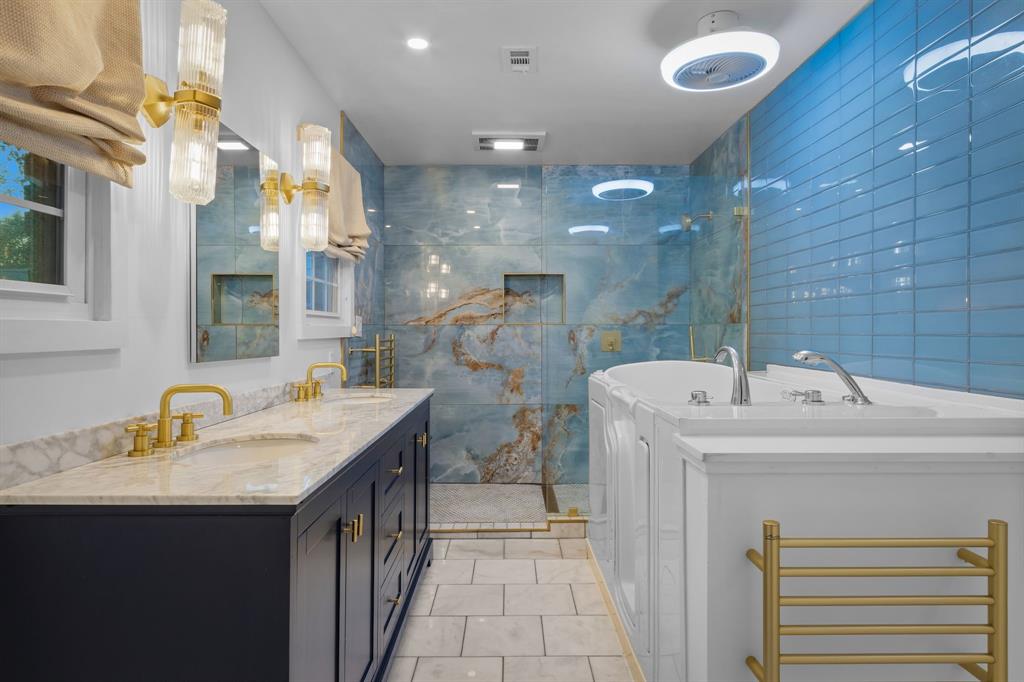 2208 Lake Ridge Circle Waco, TX 76710 - Photo 6 of 40 Full bath featuring double vanity, a stall shower, a freestanding bath, and light tile patterned floors