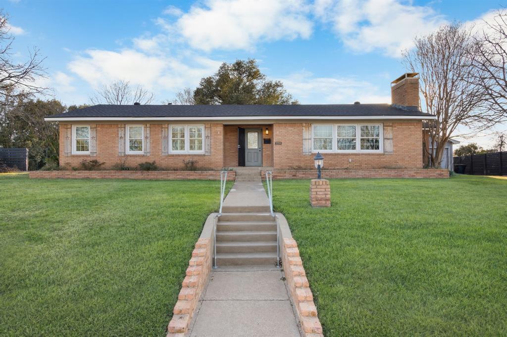 2208 Lake Ridge Circle Waco, TX 76710 - Photo 7 of 40 Ranch-style home with a front lawn, brick siding, and a chimney