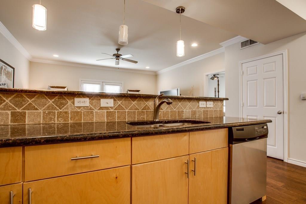 3102 Kings Road, Unit 3310 Dallas, TX 75219 - Photo 8 of 19 a kitchen with stainless steel appliances granite countertop a sink and cabinets