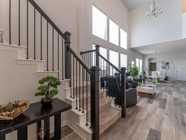 a view of an entryway and livingroom with wooden floor