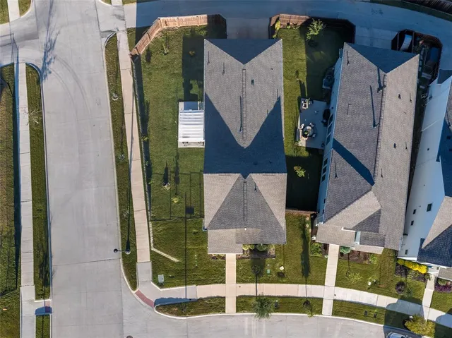 an aerial view of a house with a swimming pool